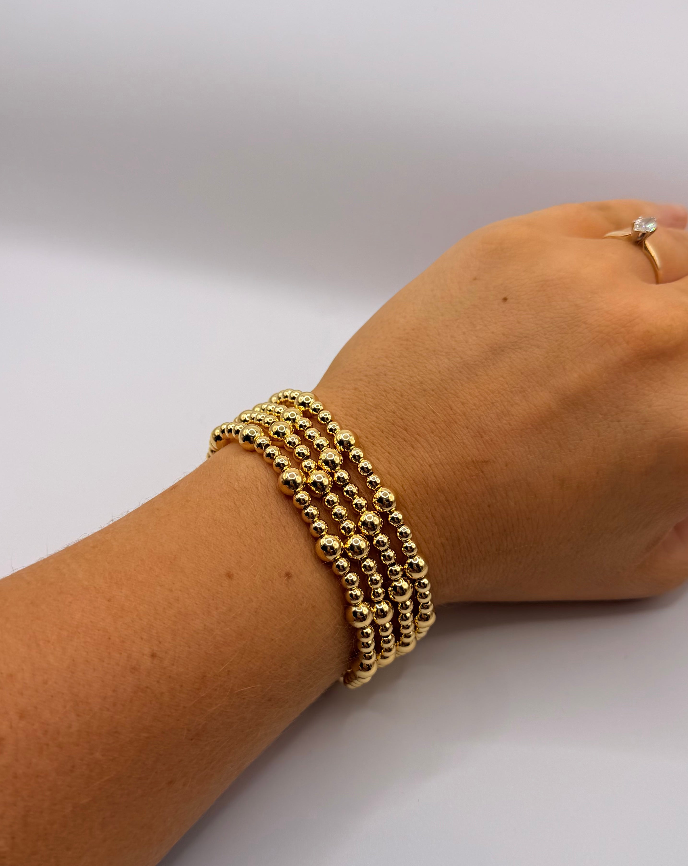 RG Set Of 4 Gold Beaded Bracelets